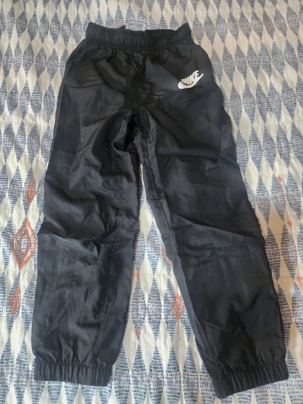 Kids Nike Black Track Pants with White Swoosh Logo